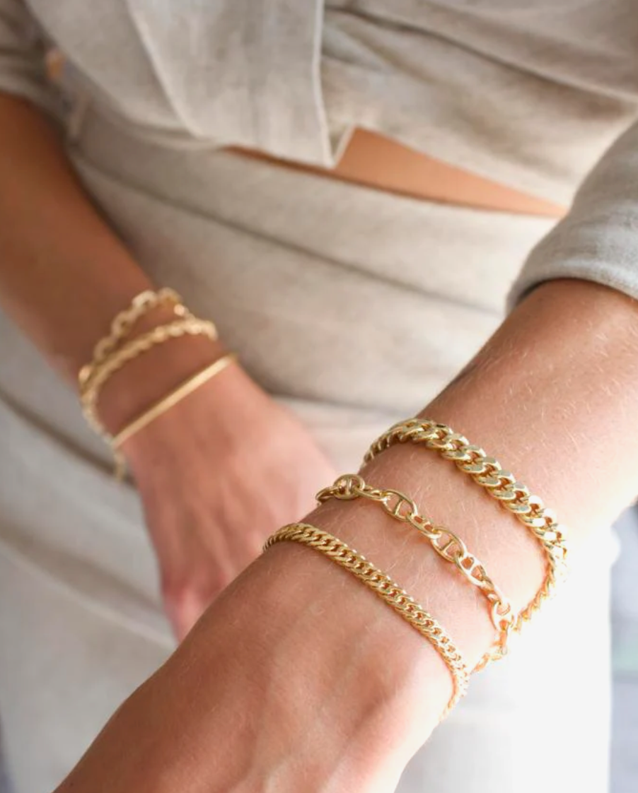 Gold jewelry styled for travel
